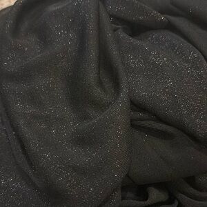 2.375 yards of sheer black knit with silver sparkles
